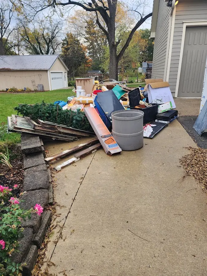 Dumpster being loaded with debris for Residential Dumpster Rental in Westerly